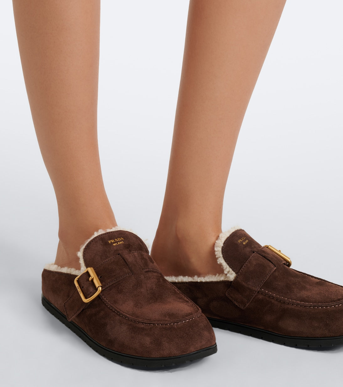 Prada Shearling-Lined Suede Buckle Mules – Dark Brown